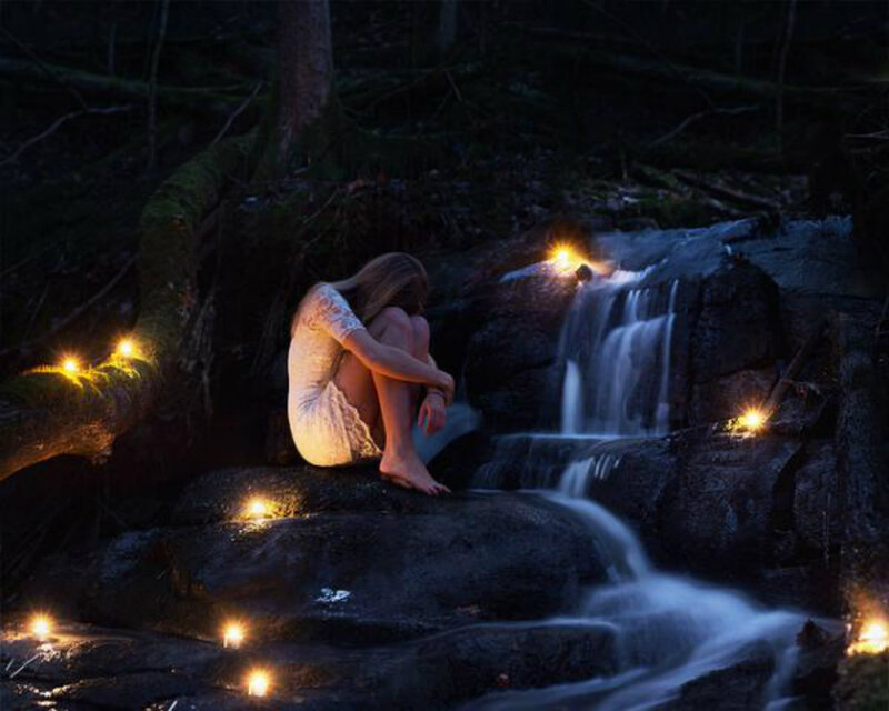 Woman Sitting by Waterfall — Black