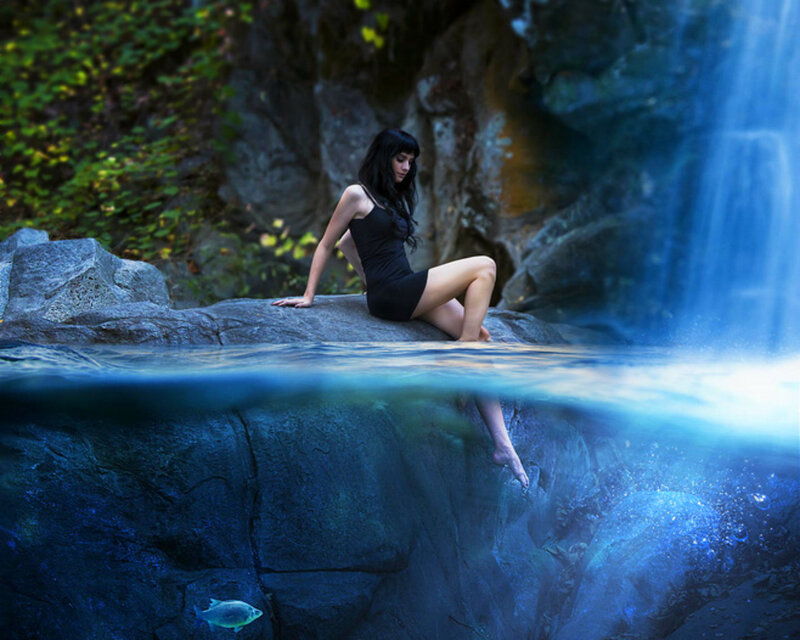 Woman Sitting by Waterfall — Blue, Serene, Afternoon, Photograph