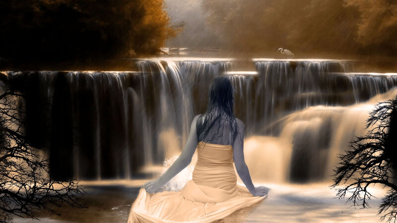 Woman Sitting by Waterfall — Brown