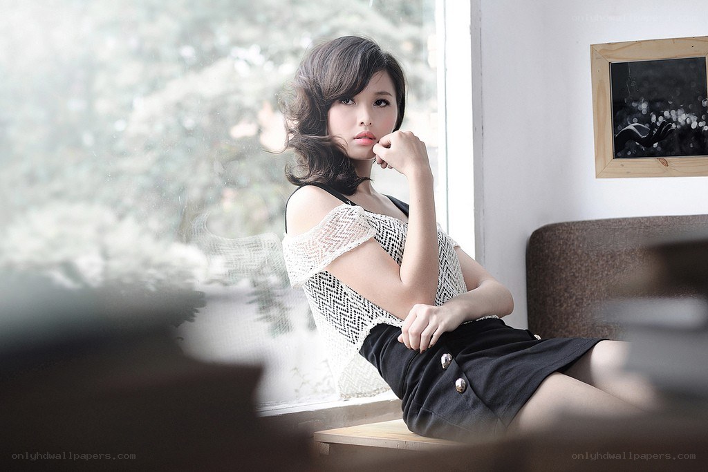 woman sitting by window