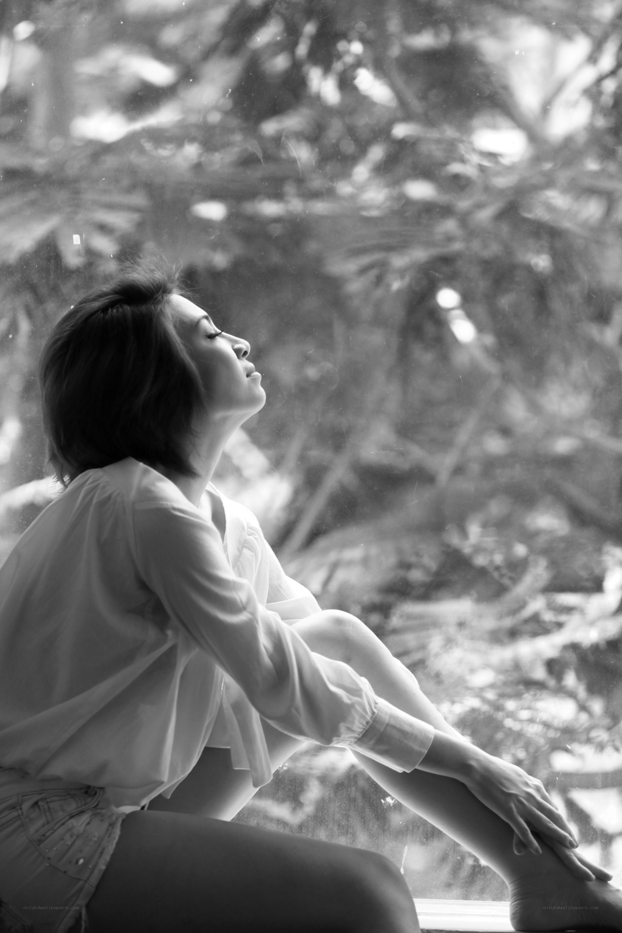 woman sitting by window