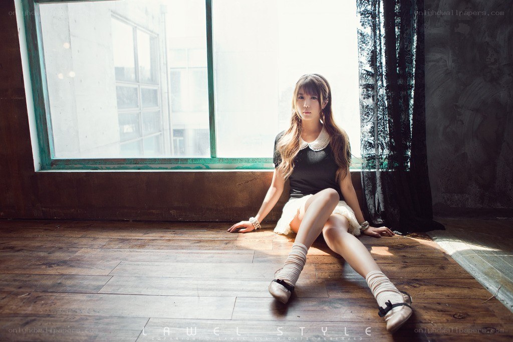 woman sitting by window