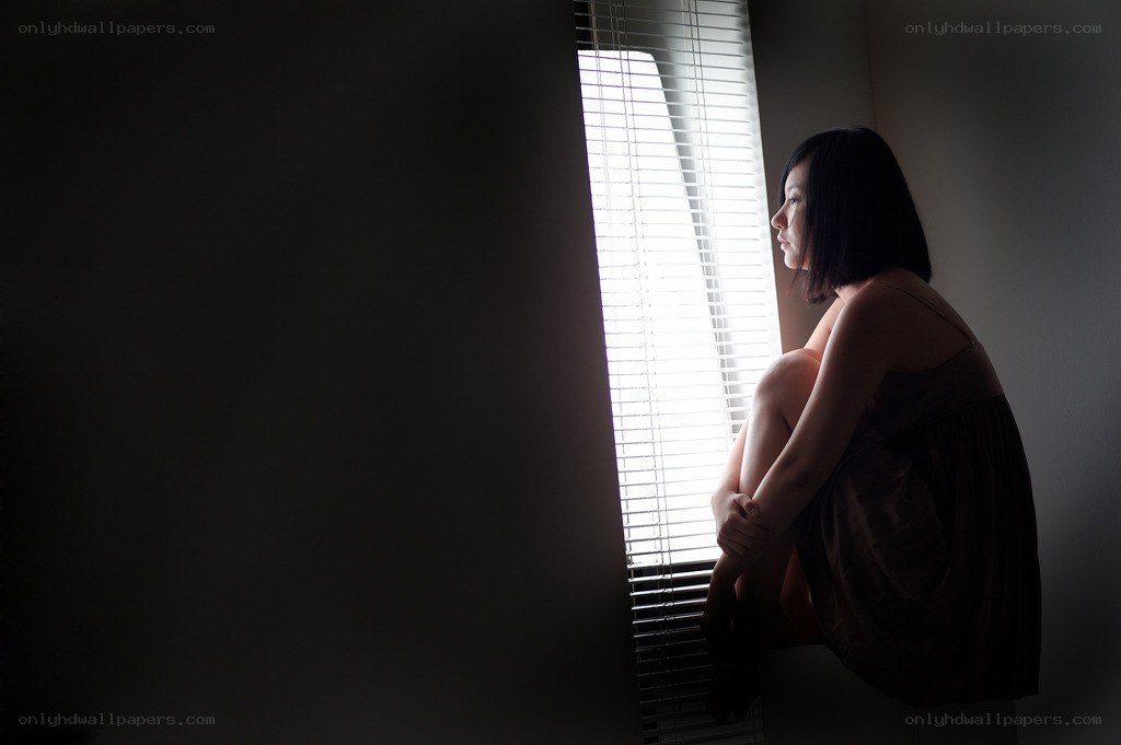 woman sitting by window