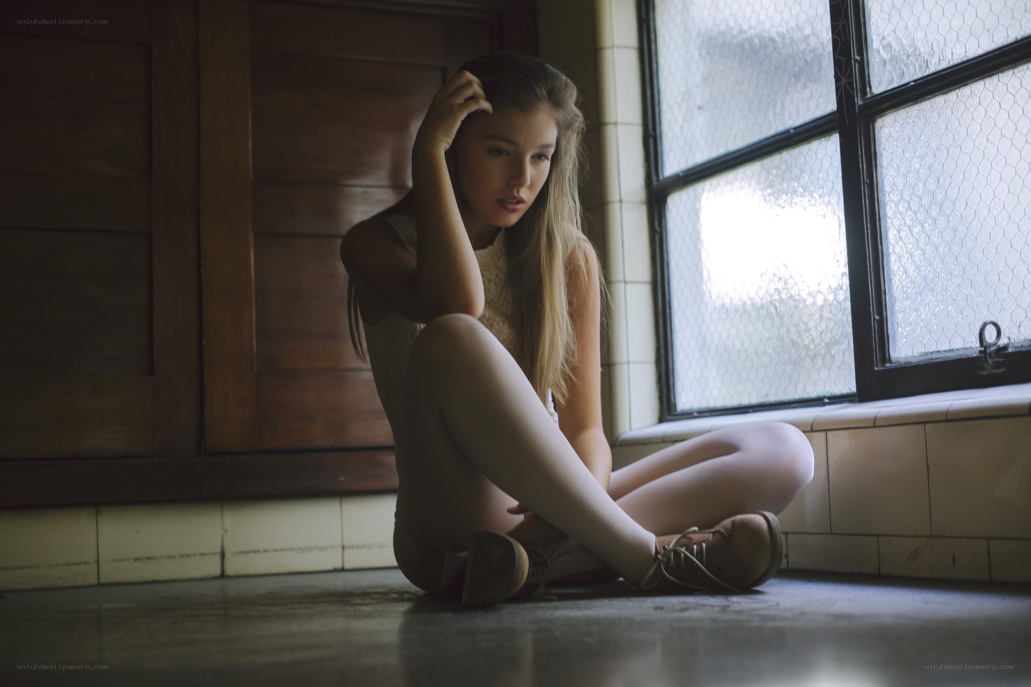 woman sitting by window