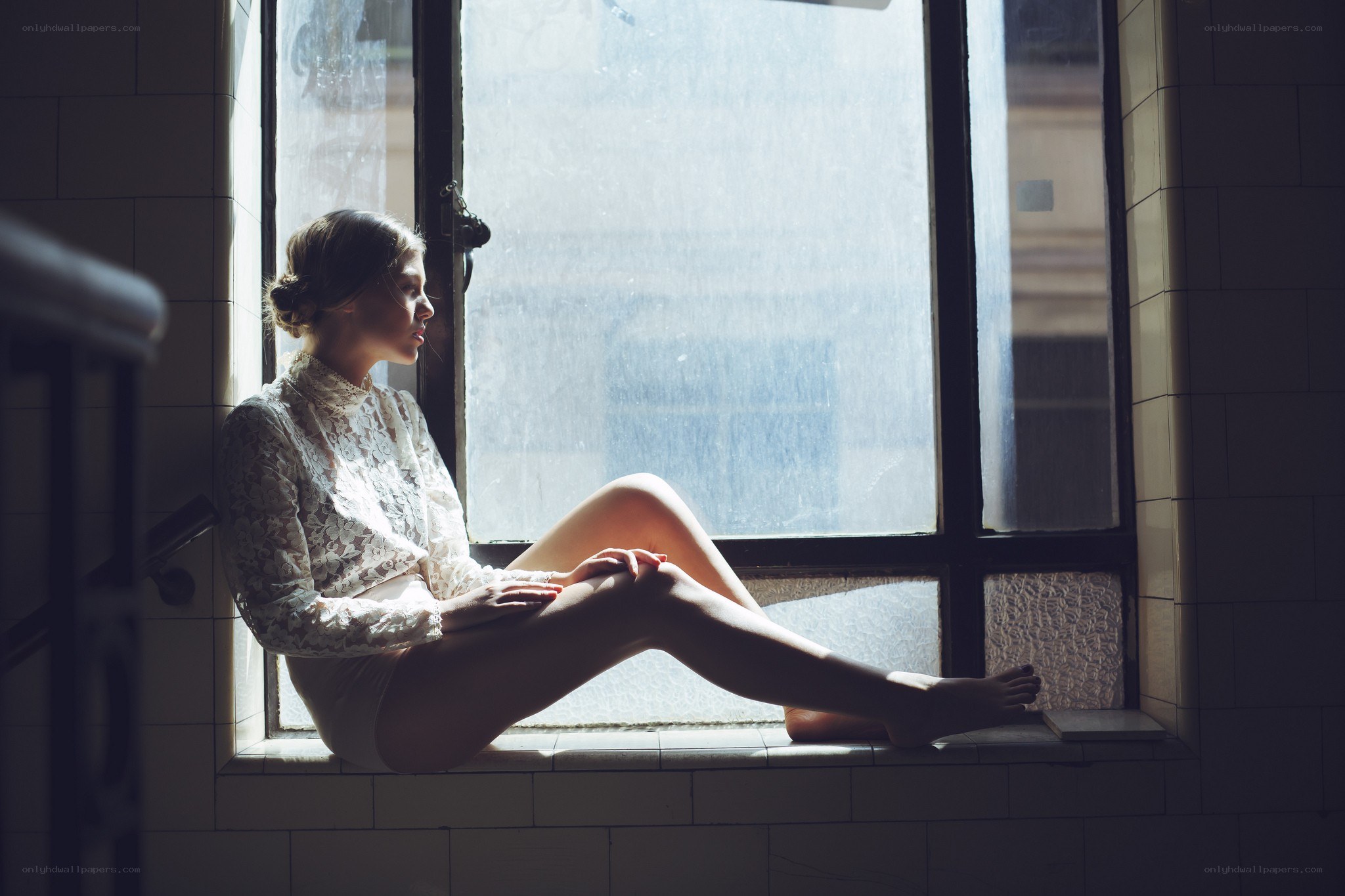 woman sitting by window