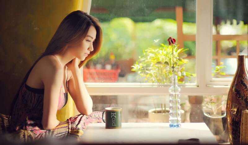 woman sitting by window