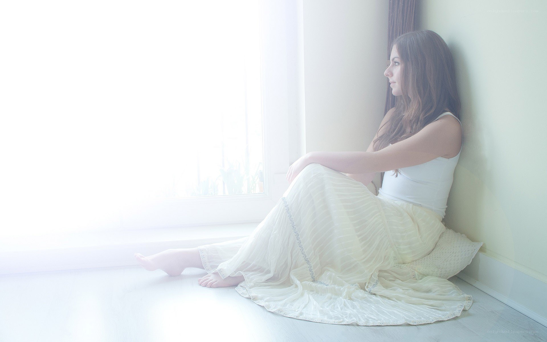 woman sitting by window