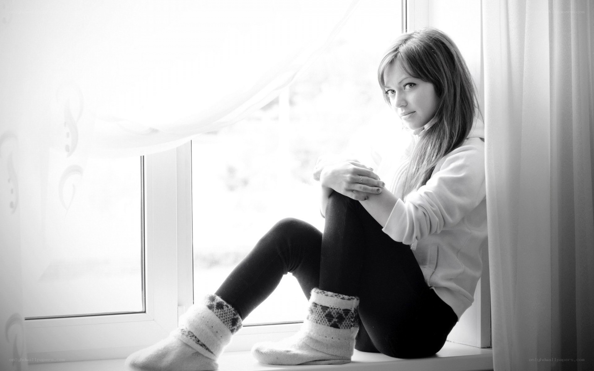 woman sitting by window