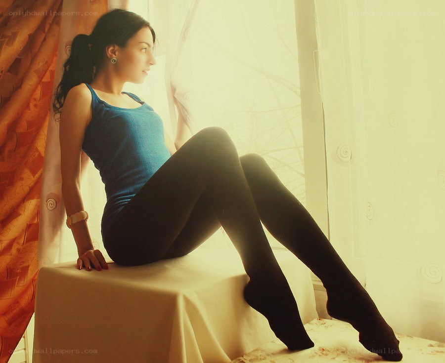 woman sitting by window