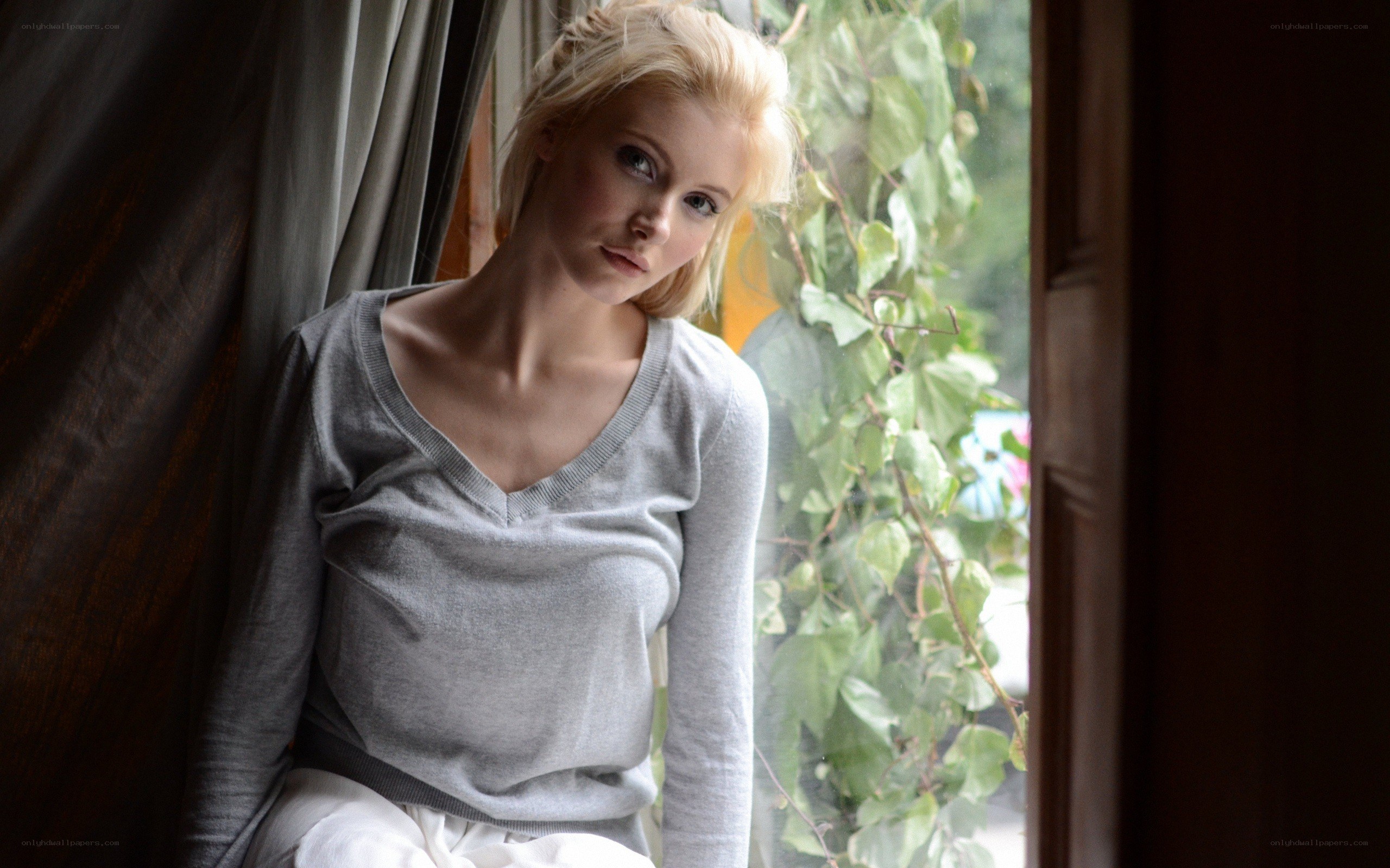 woman sitting by window