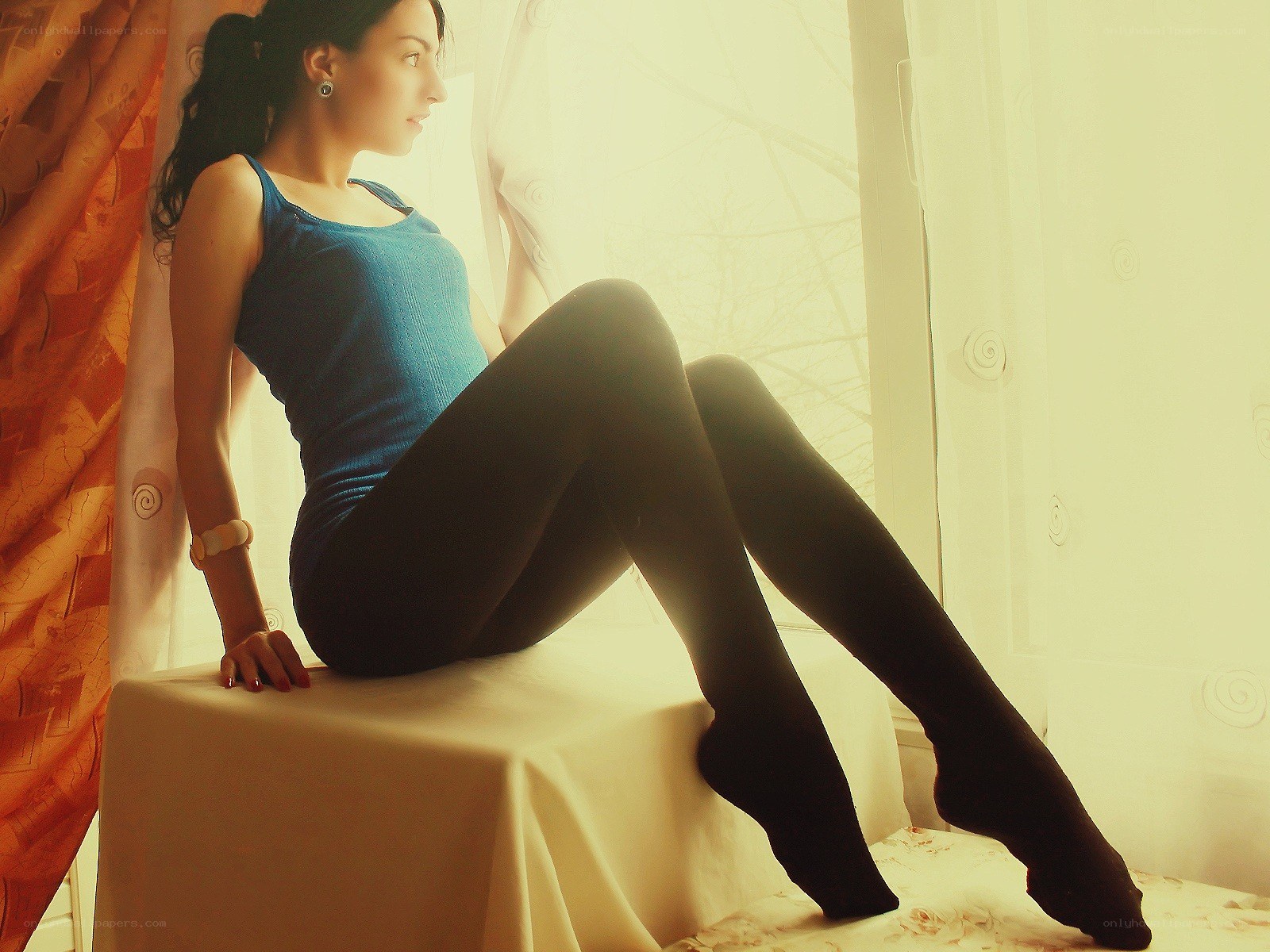 woman sitting by window