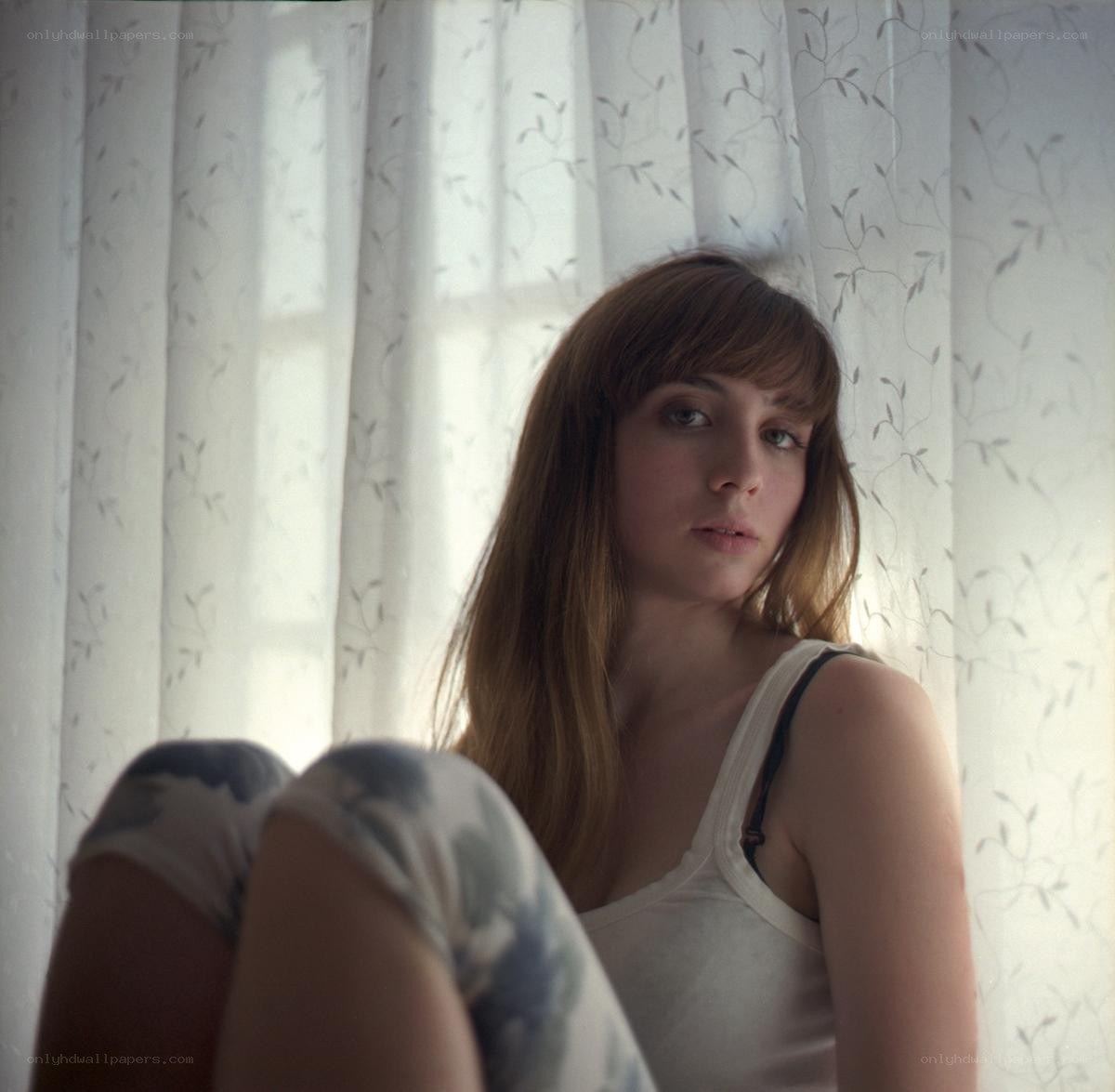 woman sitting by window