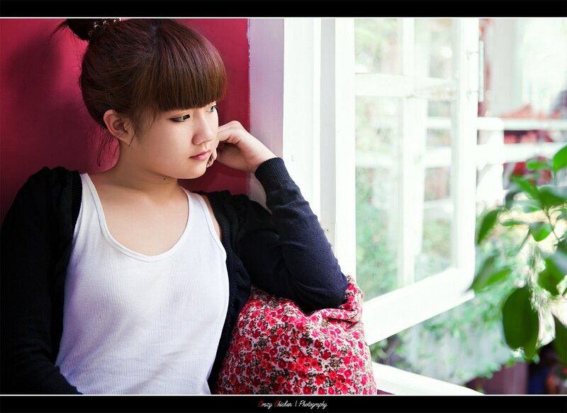 woman sitting by window