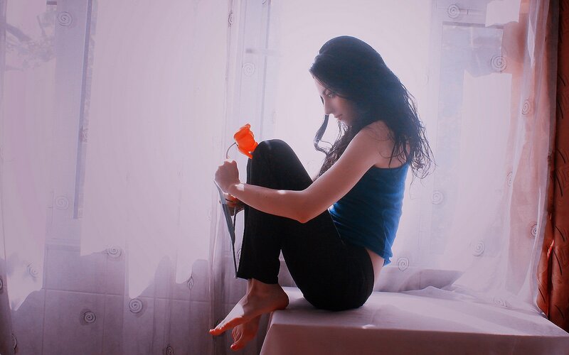 woman sitting by window