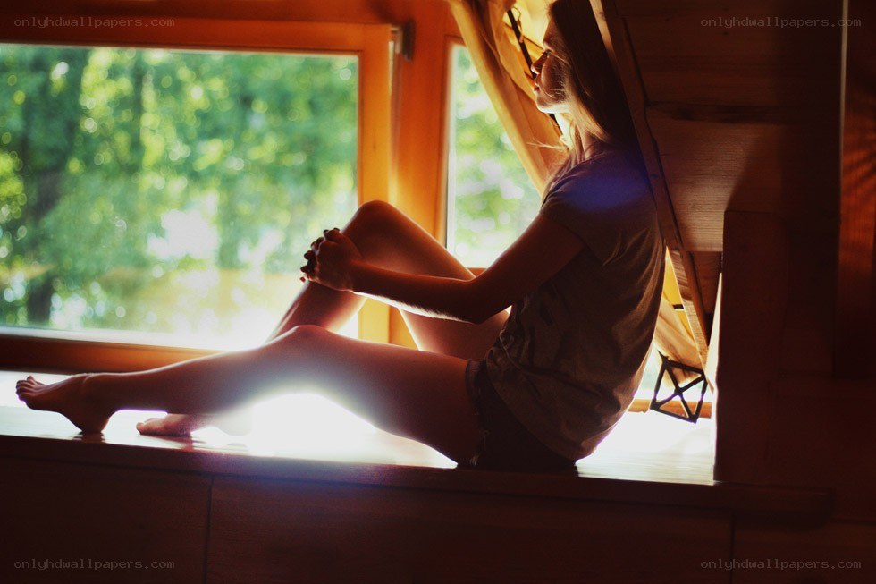 woman sitting by window
