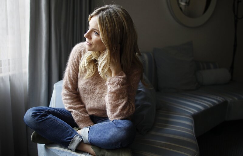 woman sitting by window