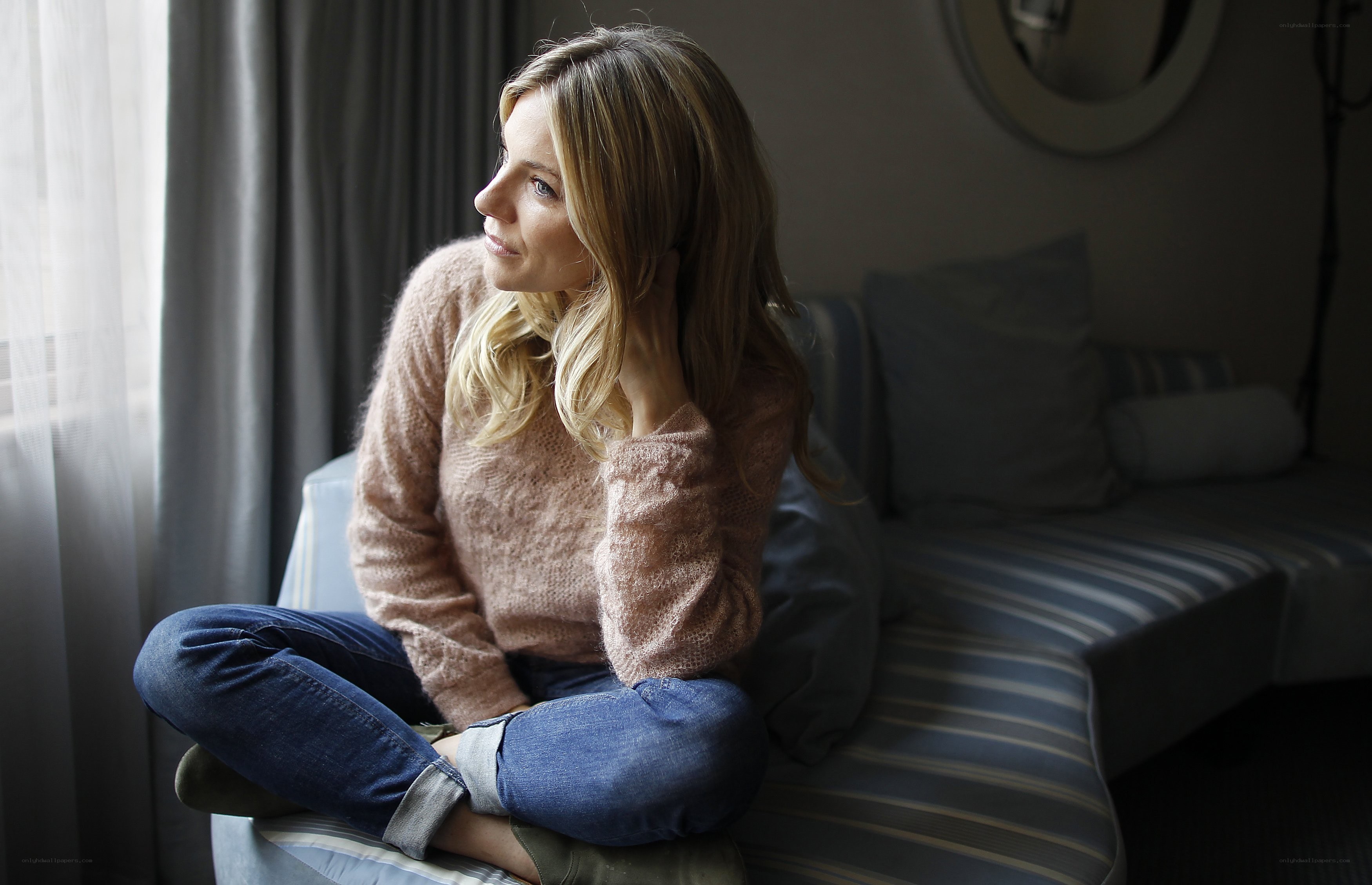 woman sitting by window