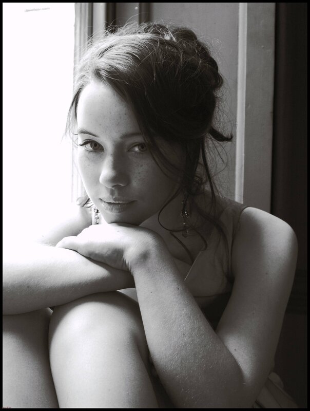 woman sitting by window