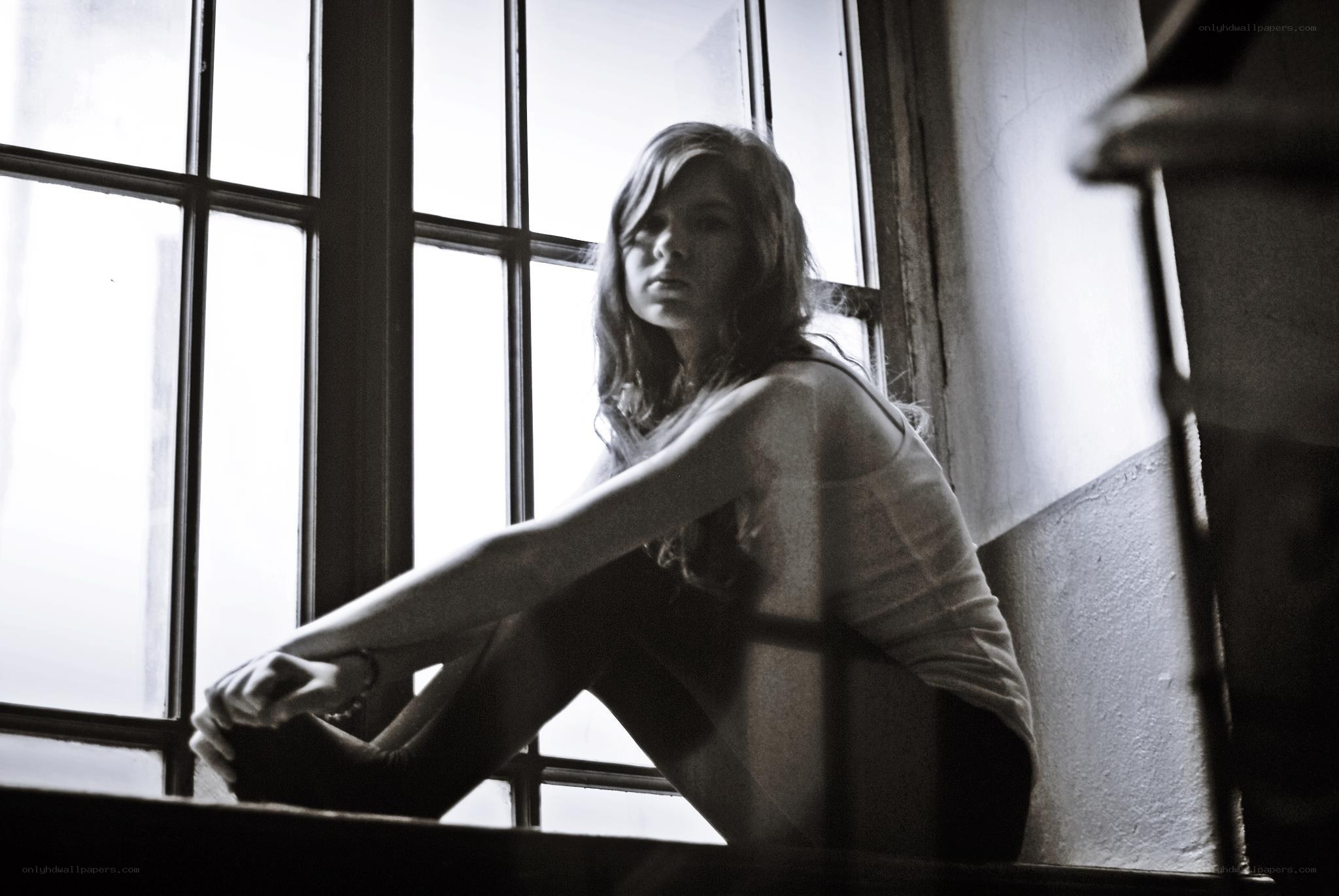 woman sitting by window