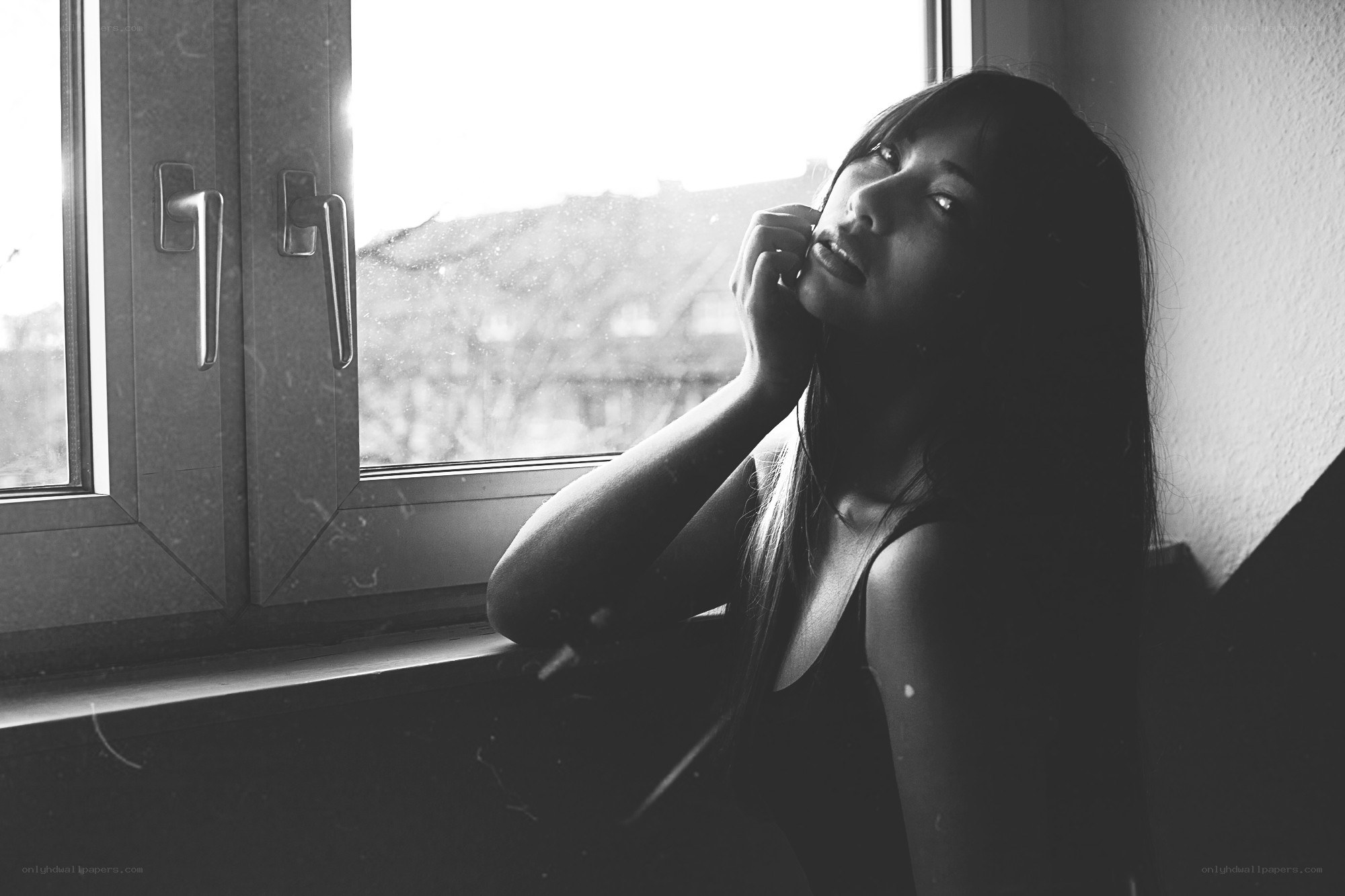 woman sitting by window