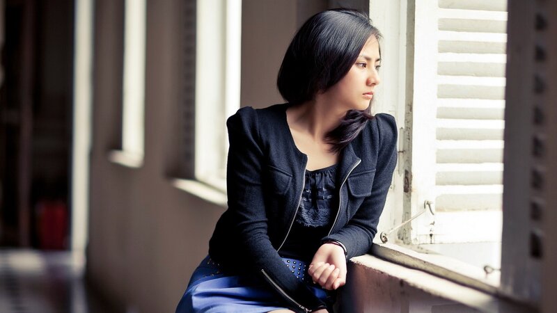 woman sitting by window