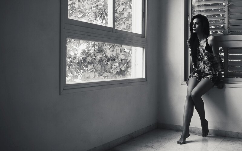 woman sitting by window