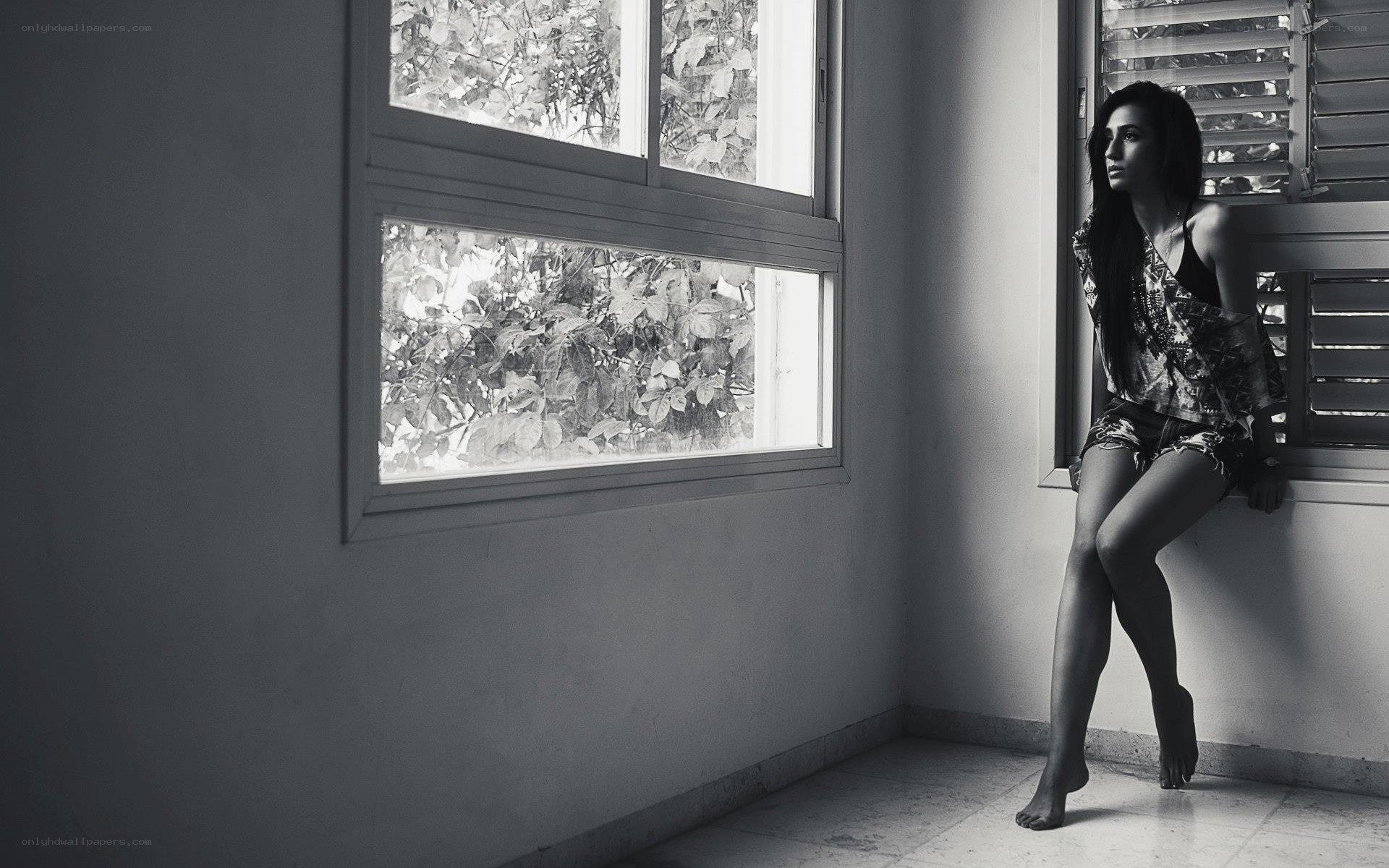 woman sitting by window