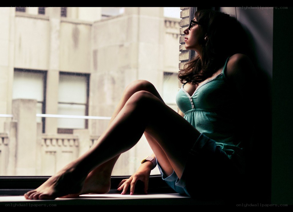 woman sitting by window