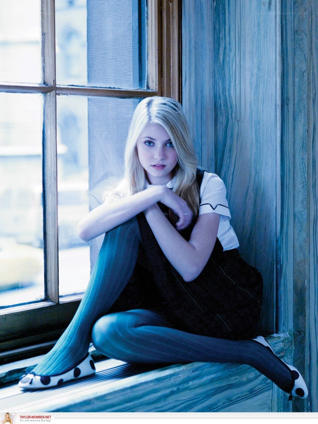 woman sitting by window