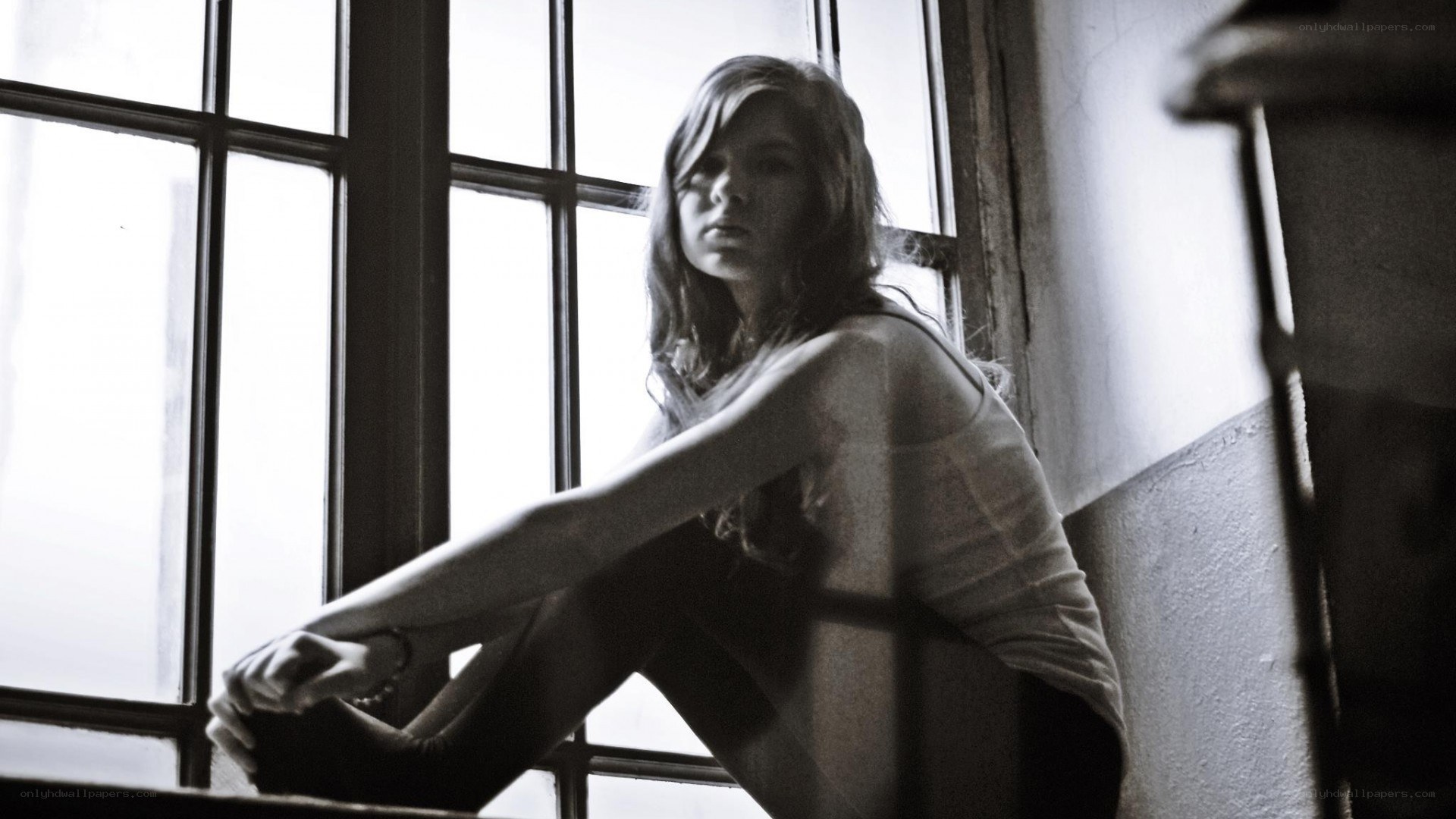 woman sitting by window