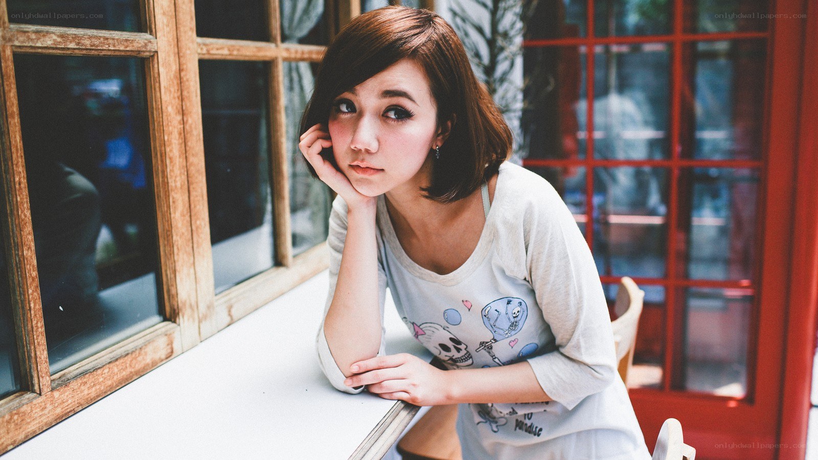 woman sitting by window