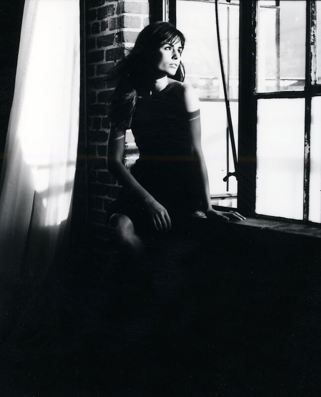 woman sitting by window