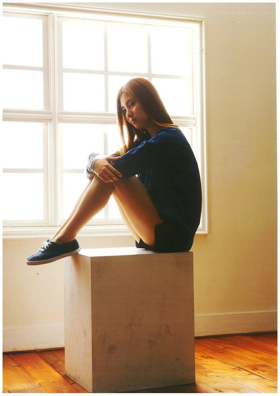 woman sitting by window