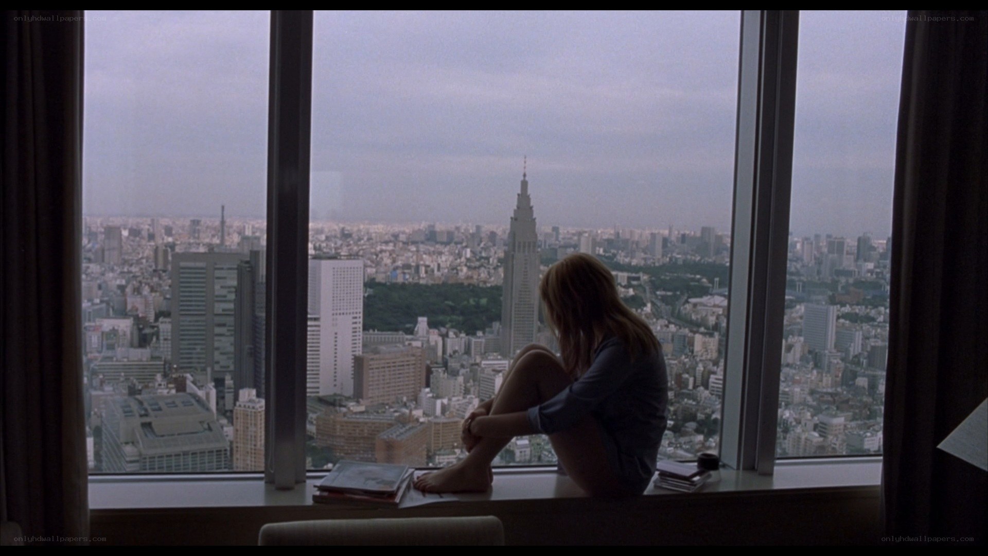 woman sitting by window