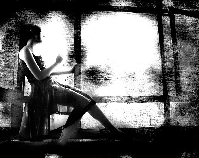 woman sitting by window