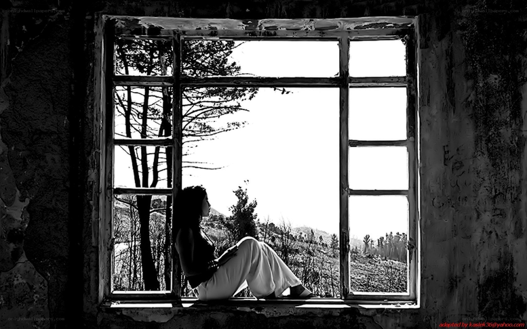 Woman sitting by window