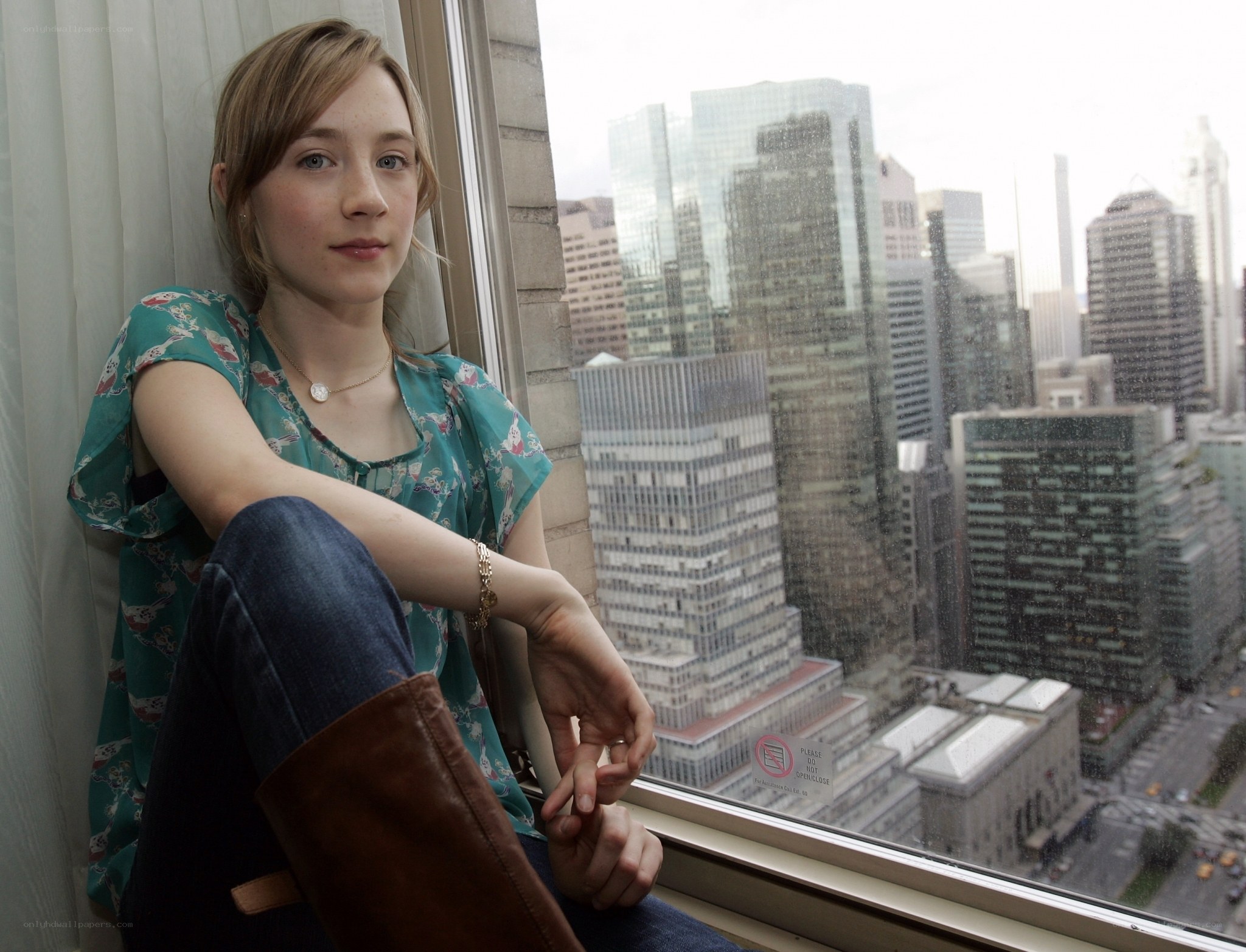 woman sitting by window