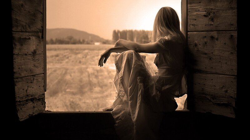 woman sitting by window