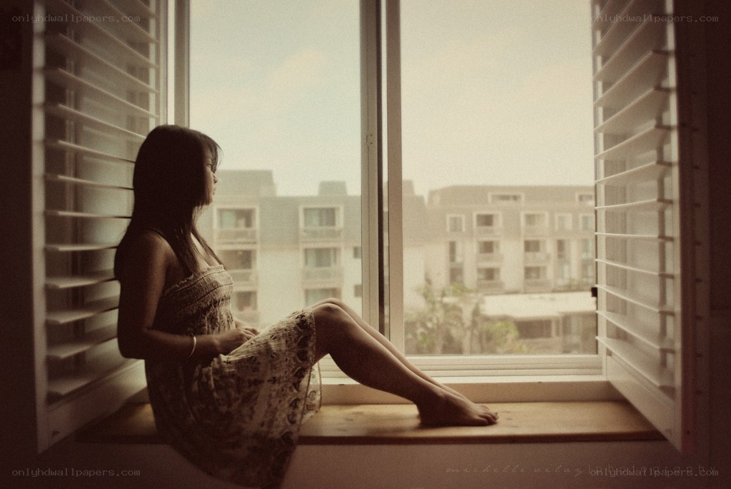 woman sitting by window