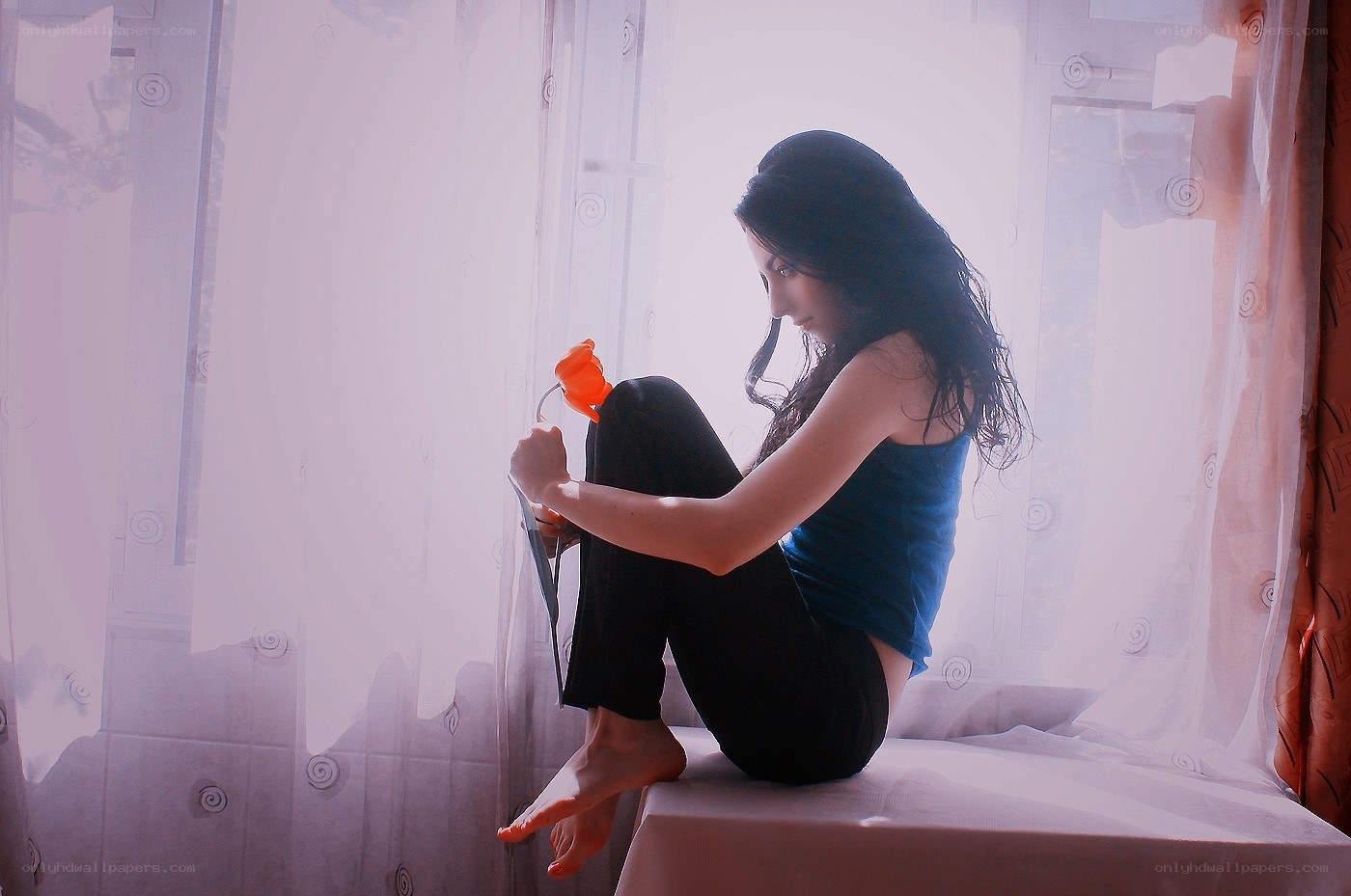 woman sitting by window