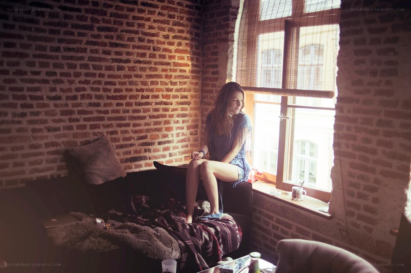 woman sitting by window