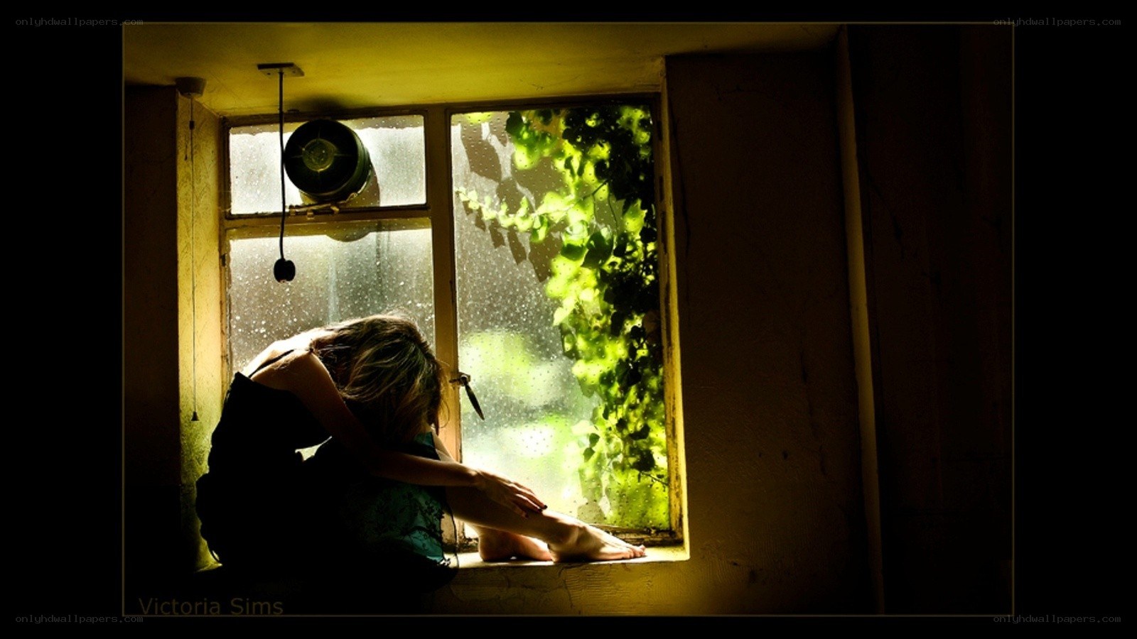 woman sitting by window