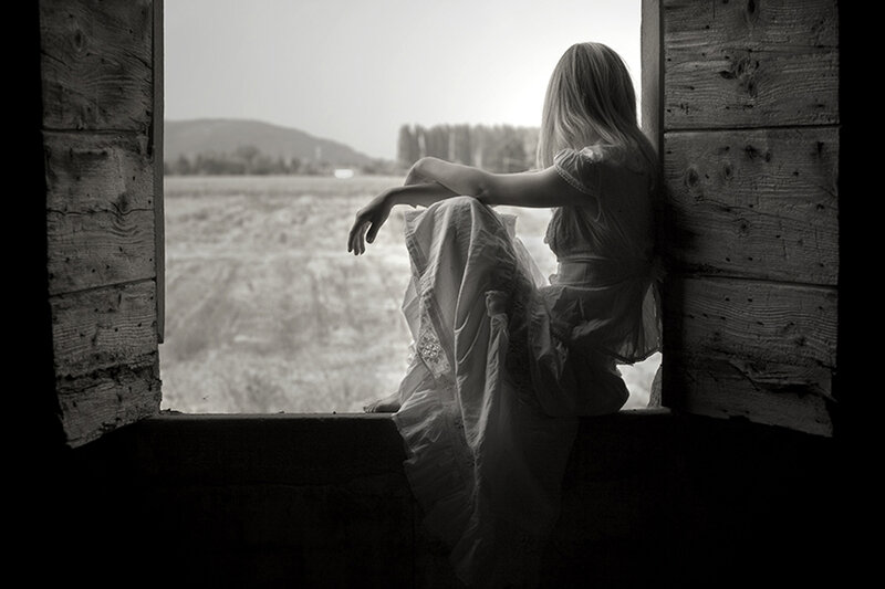 Woman Sitting by Window — Black, Contemplative, Photograph, Field