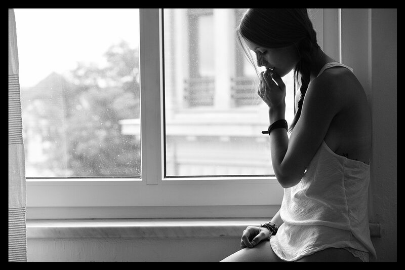 Woman Sitting by Window — Black, Contemplative, Photograph