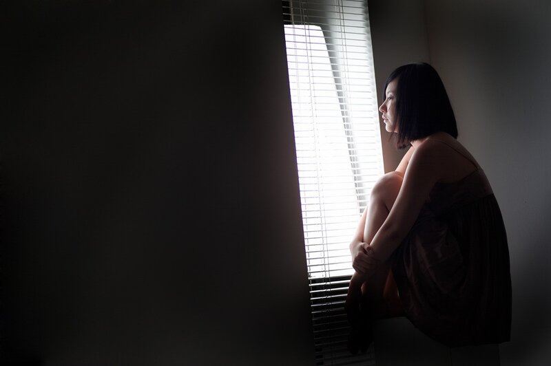 Woman Sitting by Window — Black, Dramatic, Night, Photograph