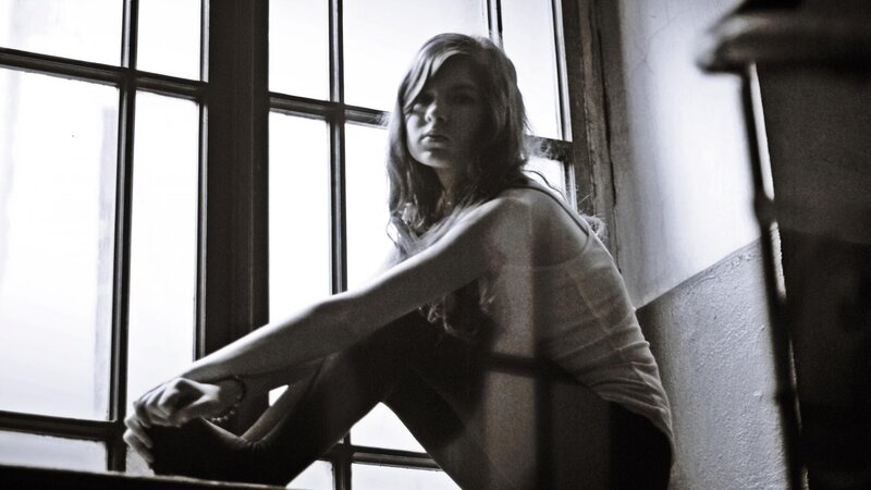 Woman Sitting by Window — Black, Dramatic, Photograph, Wall, Arm