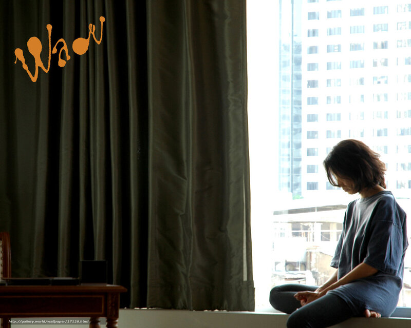 woman sitting by window