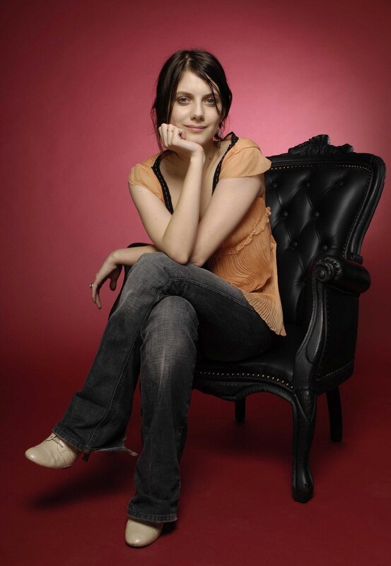 woman sitting in a black chair