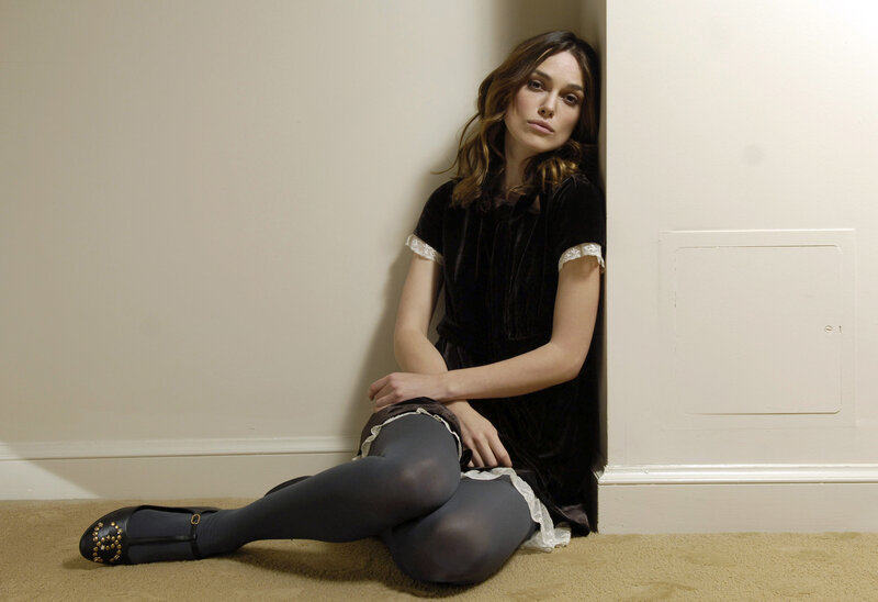 woman sitting in a corner