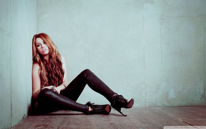 woman sitting in a corner